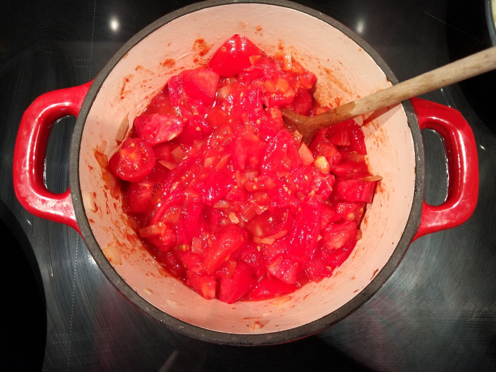 Adding the tomato cubes for the sauce.